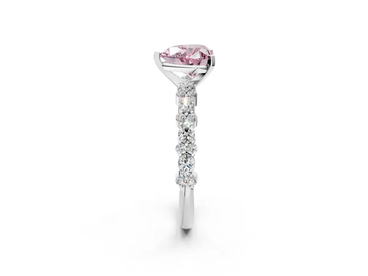 Fancy Pink Heart Cut Diamond Side Stone Solitaire Ring with Round and Four-Prong Setting Platinum
