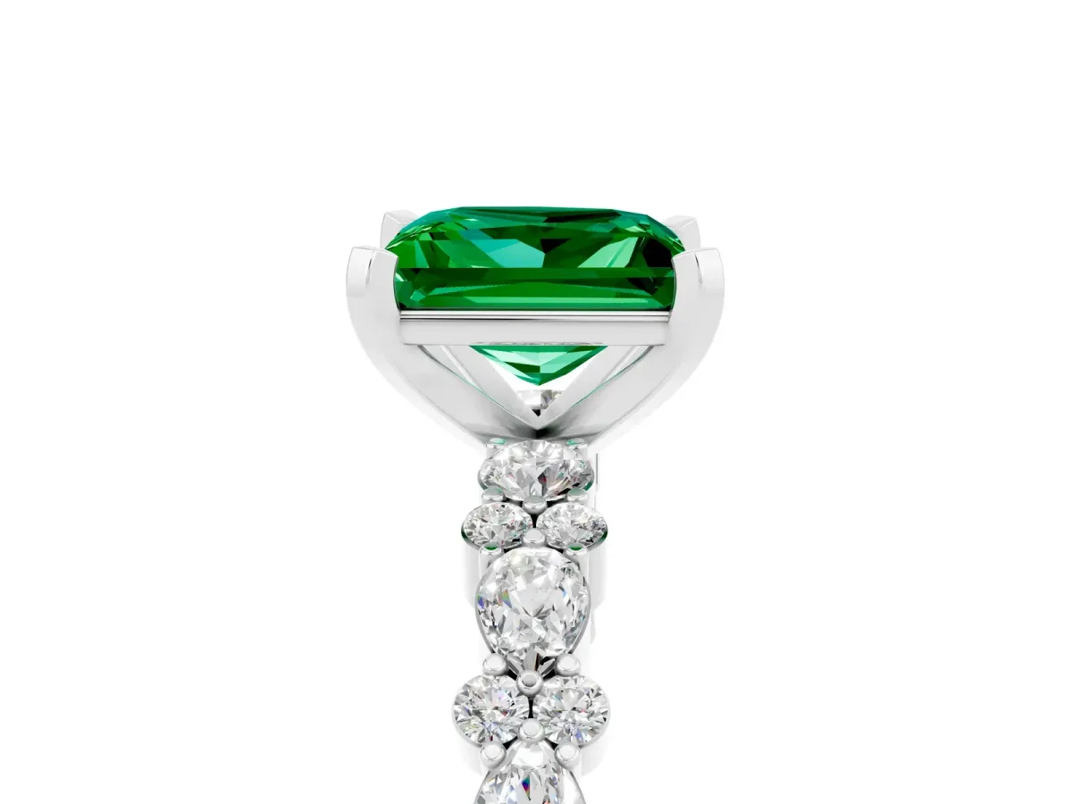Princess Cut Emerald Side Stone Solitaire Ring with Round and Four-Prong Setting Silver
