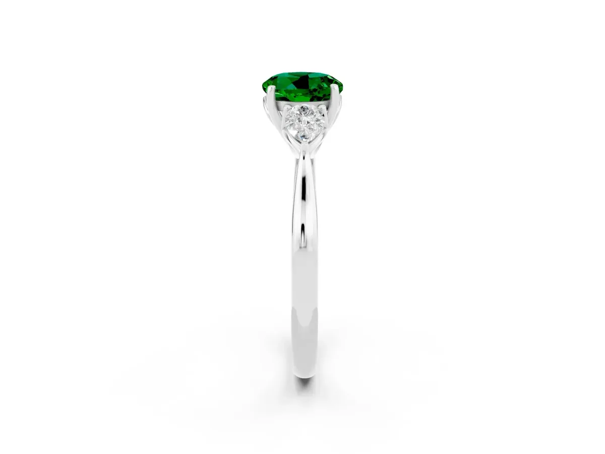 Three-Stone Round Cut Emerald Ring with Pear Side Stones in Four-Prong Setting Platinum