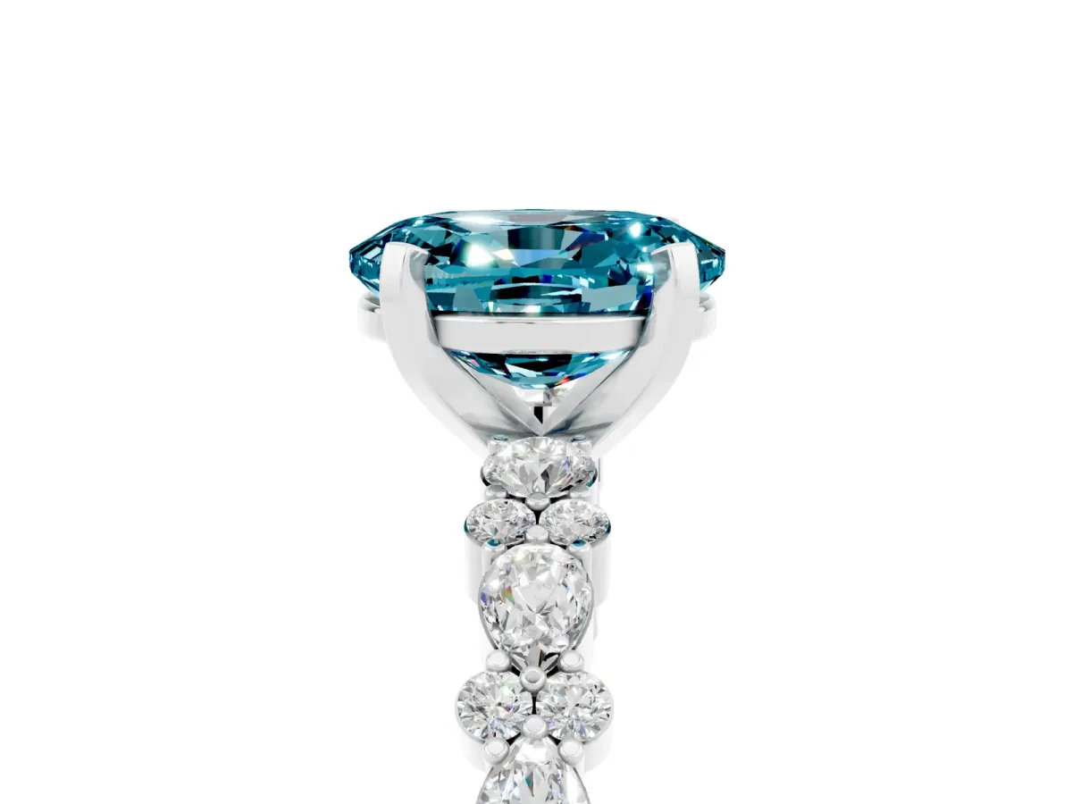 Oval Cut Blue Topaz Side Stone Solitaire Ring with Round and Four-Prong Setting Silver