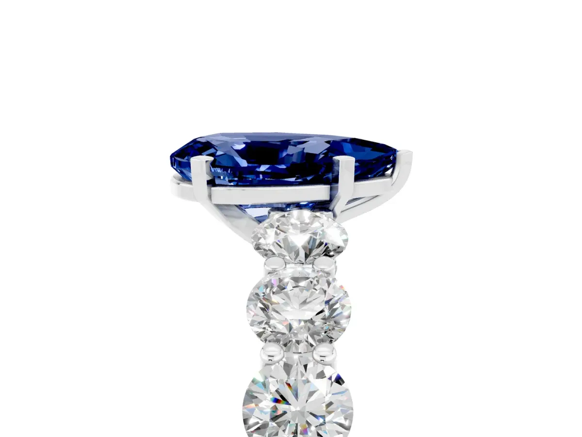 Pear Cut Blue Sapphire Prong Setting with Side Stones on a Pave Band Silver