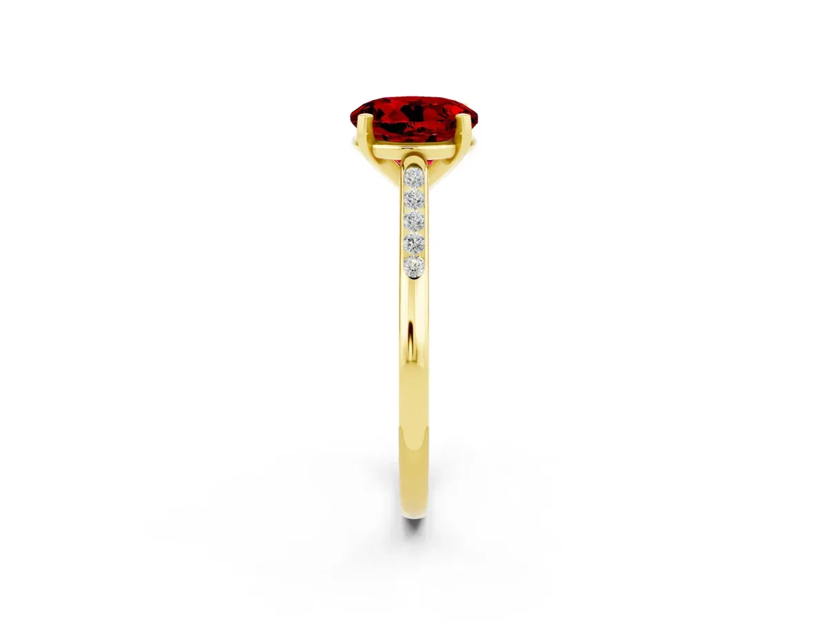 Round Cut Ruby Solitaire Ring with Channel Set Round Band and Prong Setting Yellow gold
