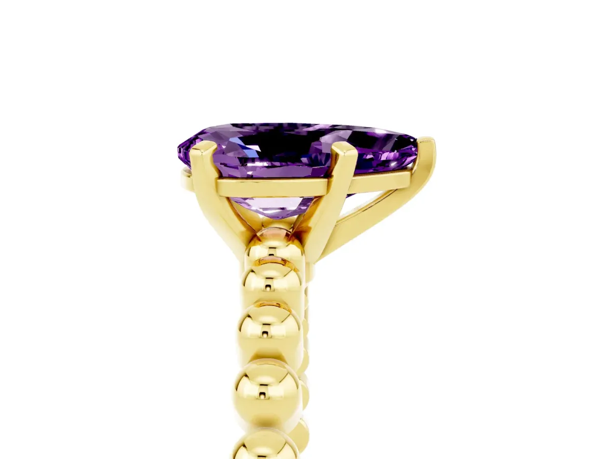 Pear Cut Amethyst Solitaire Ring with Beaded Band and Prong Setting Yellow gold