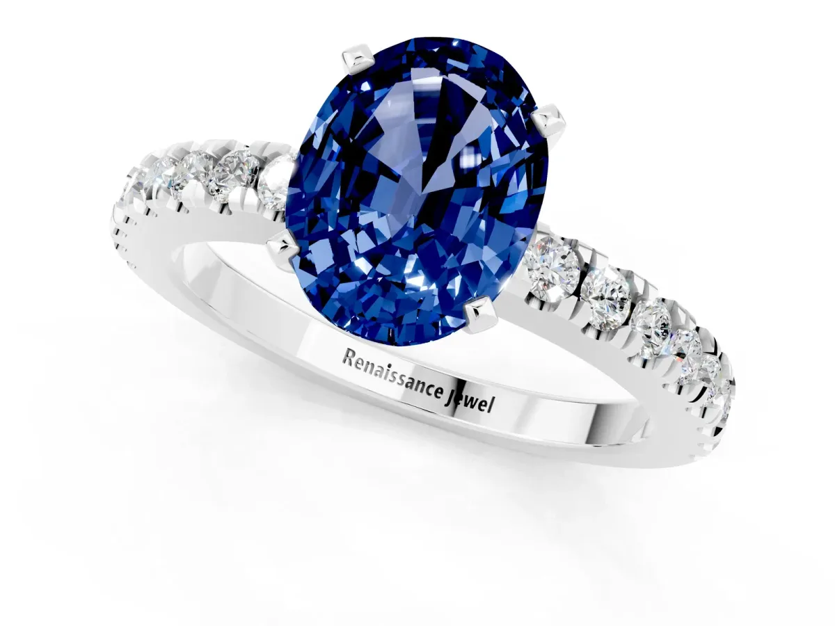 Oval Cut Solitaire Blue Sapphire with Pavé Band and Four-Prong Setting Silver