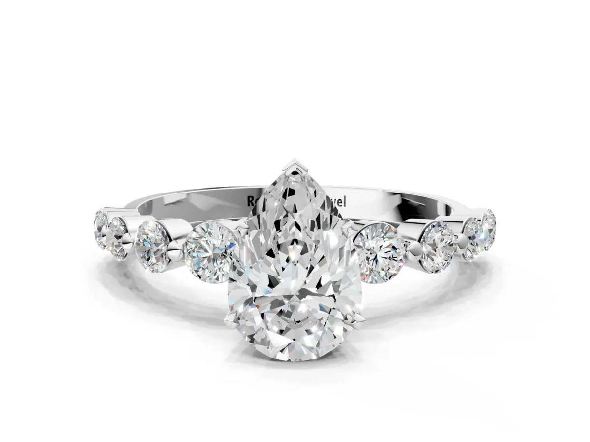 Pear Cut Solitaire Diamond Ring with Pave Band and Four-Prong Setting Platinum