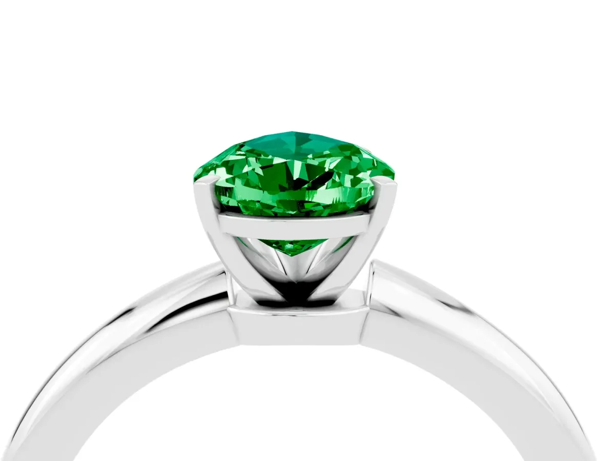 Pear Cut Emerald Solitaire Ring with Six-Prong Setting and Classic Band Silver