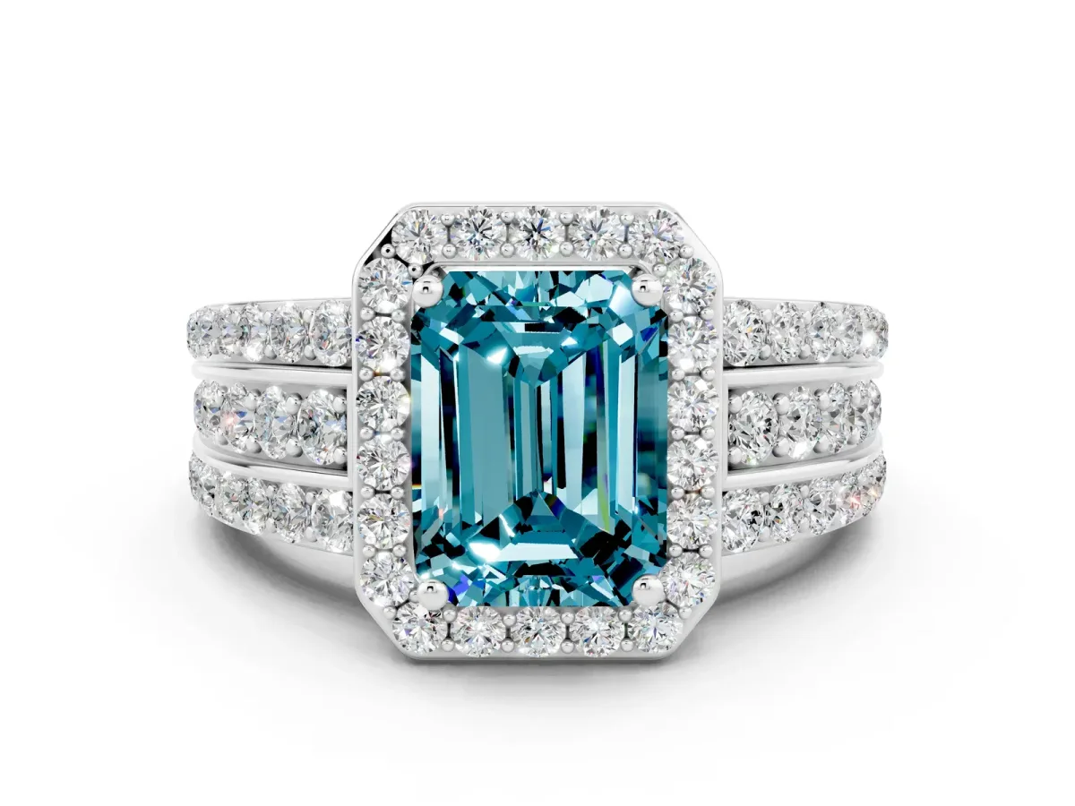 Emerald Cut Halo Blue Topaz Ring with Round Split Shank and Prong Setting White gold