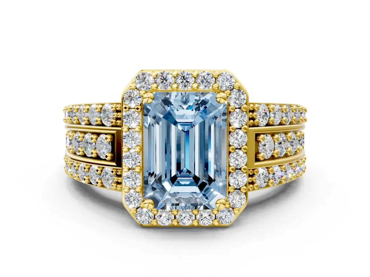 Fancy Blue Emerald Cut Halo Diamond Ring with Round Split Shank and Prong Setting Yellow gold