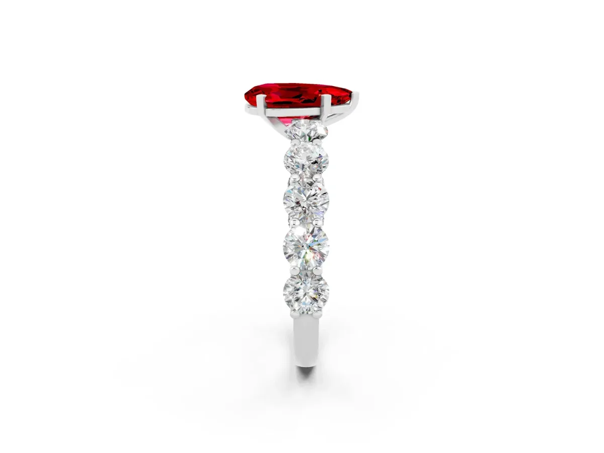 Pear Cut Ruby Prong Setting with Side Stones on a Pave Band Silver