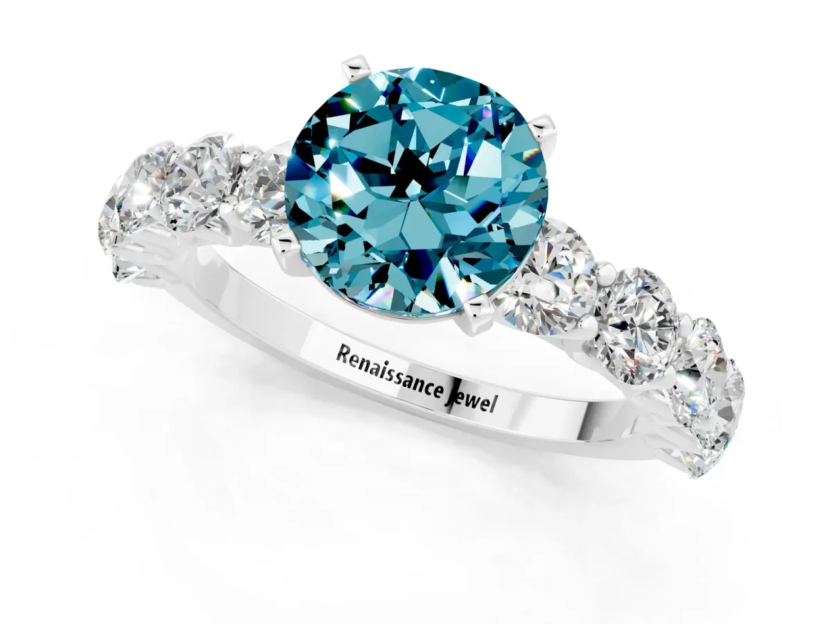 Round Cut Blue Topaz Prong Setting with Side Stones on a Pave Band Silver