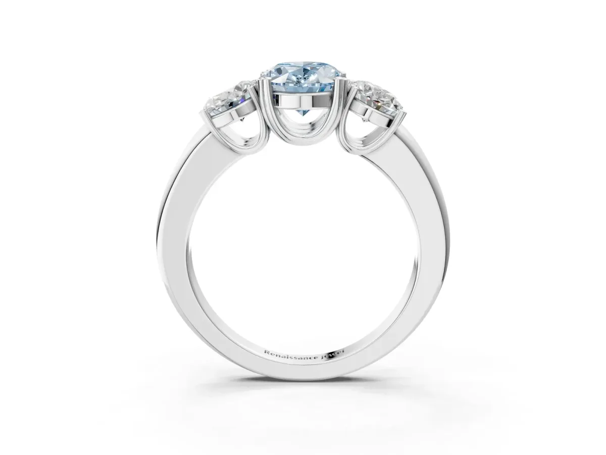 Fancy Blue Three-Stone Oval Cut Cut Diamond Ring with Channel Set Band and Four-Prong Setting Silver