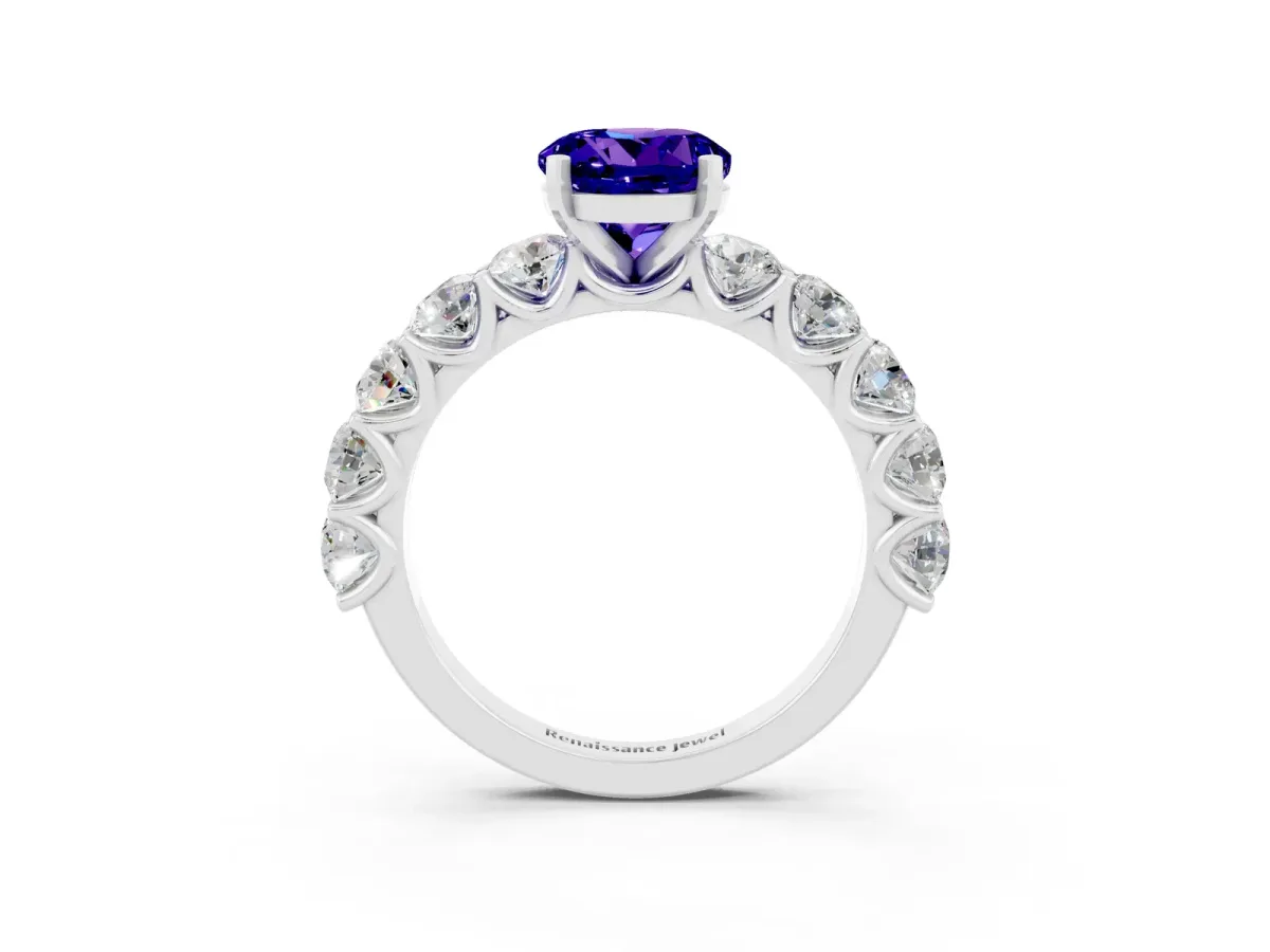 Round Cut Tanzanite Prong Setting with Side Stones on a Pave Band Silver