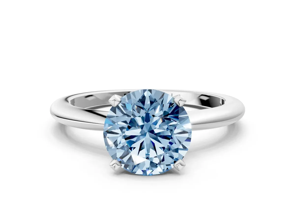 Fancy Blue Round Cut Diamond Solitaire Ring with Six-Prong Setting and Classic Band Silver