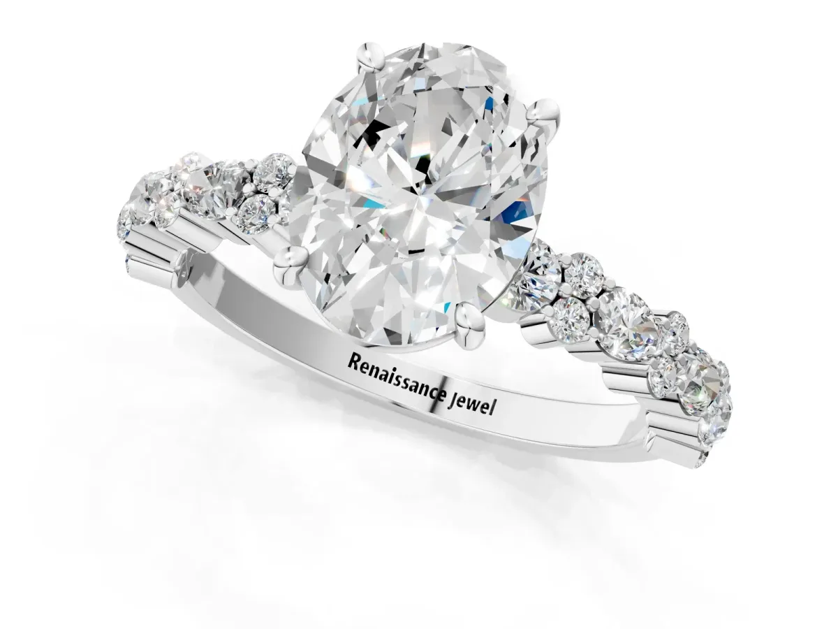 Oval Cut Diamond Side Stone Solitaire Ring with Round and Four-Prong Setting White gold