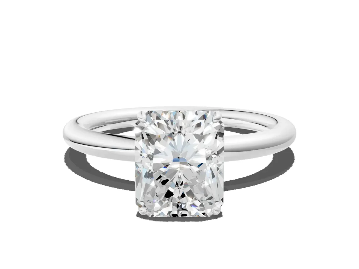 Radiant Cut Solitaire Diamond Ring with Four-Prong Setting on a Plain Band Platinum