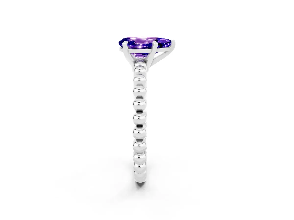 Pear Cut Tanzanite Solitaire Ring with Beaded Band and Prong Setting Silver