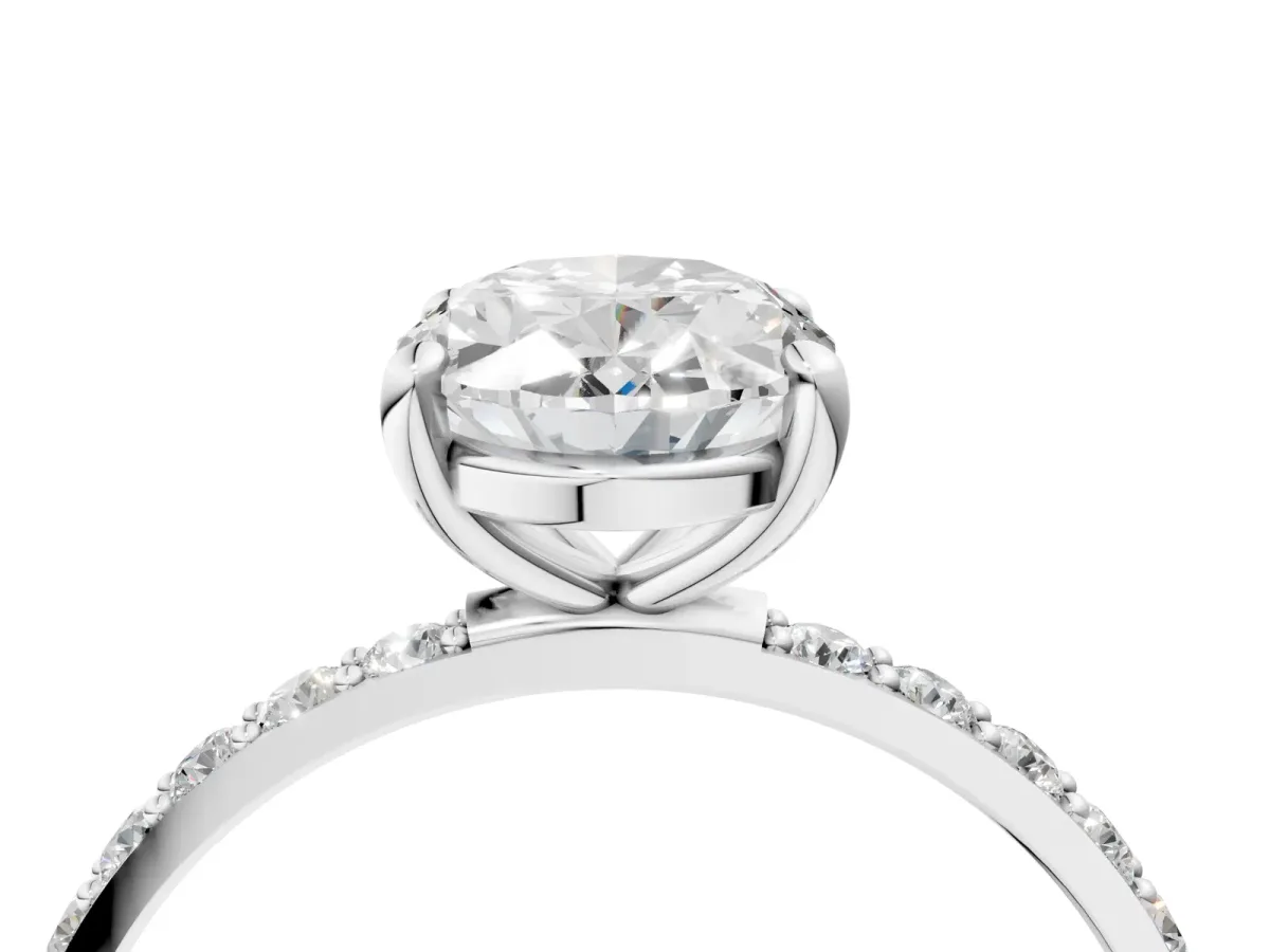 Oval Cut Diamond Solitaire Ring with Round Pavé Band and Prong Setting Silver