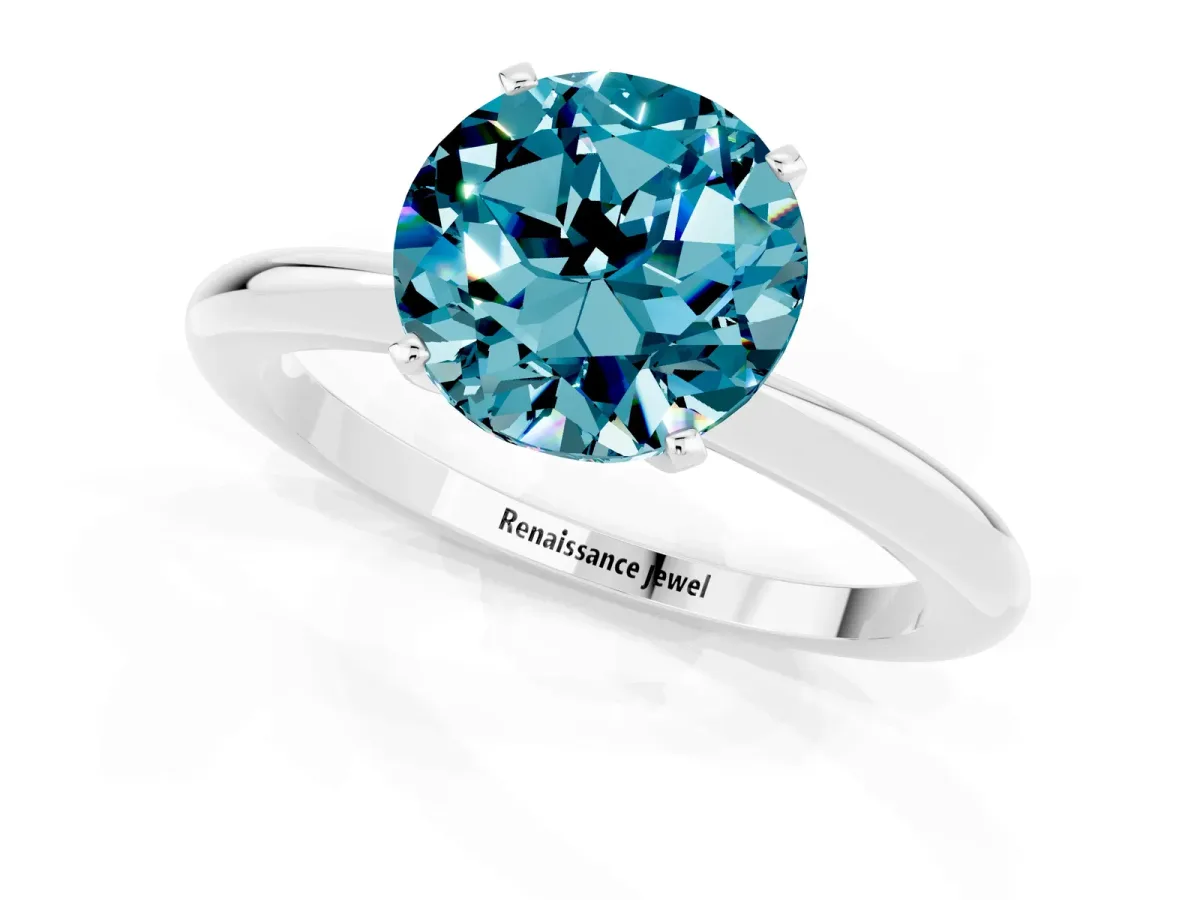 Round Cut Blue Topaz Solitaire Ring with Six-Prong Setting and Classic Band Silver
