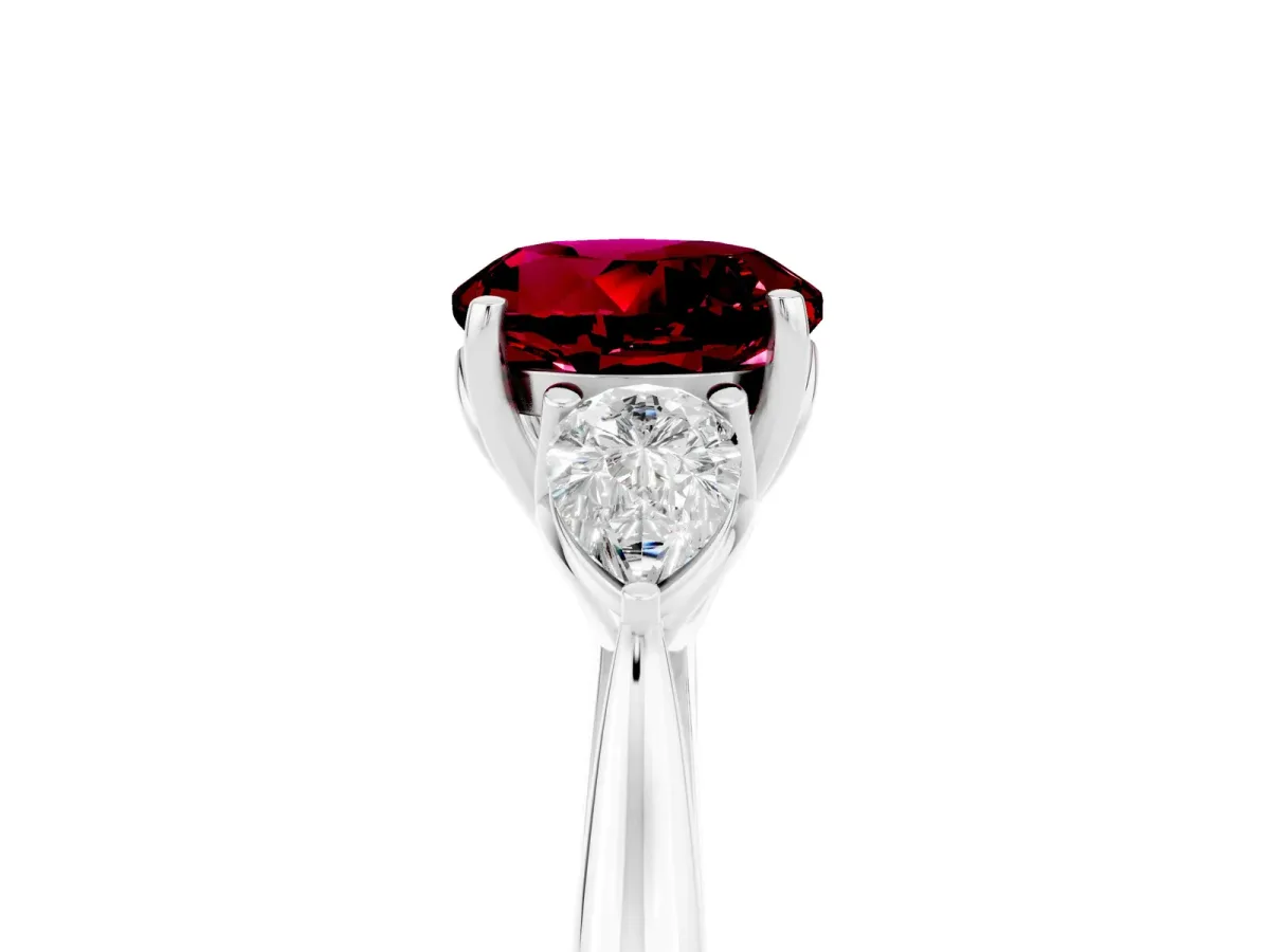 Three-Stone Round Cut Garnet Ring with Pear Side Stones in Four-Prong Setting Platinum