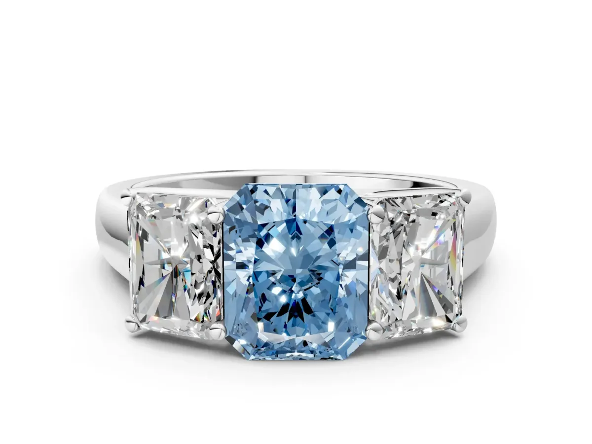Fancy Blue Radiant Cut Three-Stone Diamond Ring with Prong Setting on a Classic Band Platinum