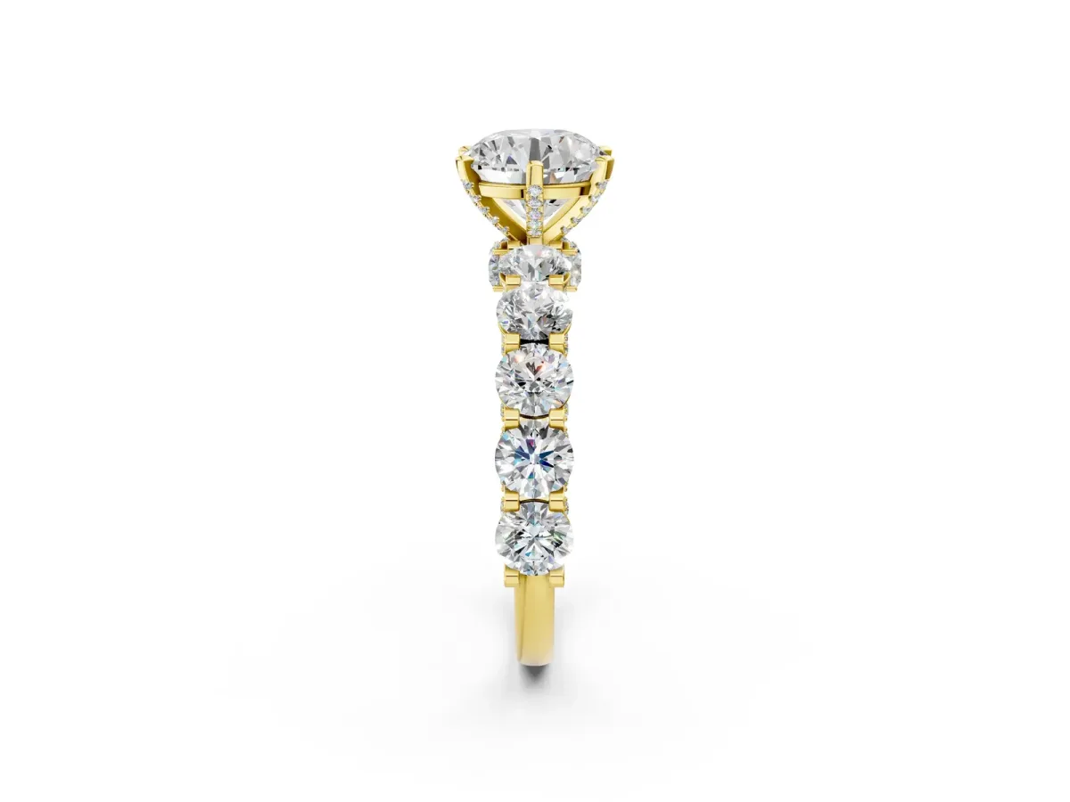 Round Cut Diamond Side Stone Engagement Ring with Four-Prong Setting Yellow gold