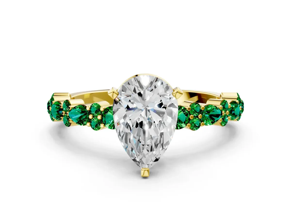 Pear Cut Diamond Side Stone Solitaire Ring with Round Emerald and Four-Prong Setting Yellow gold
