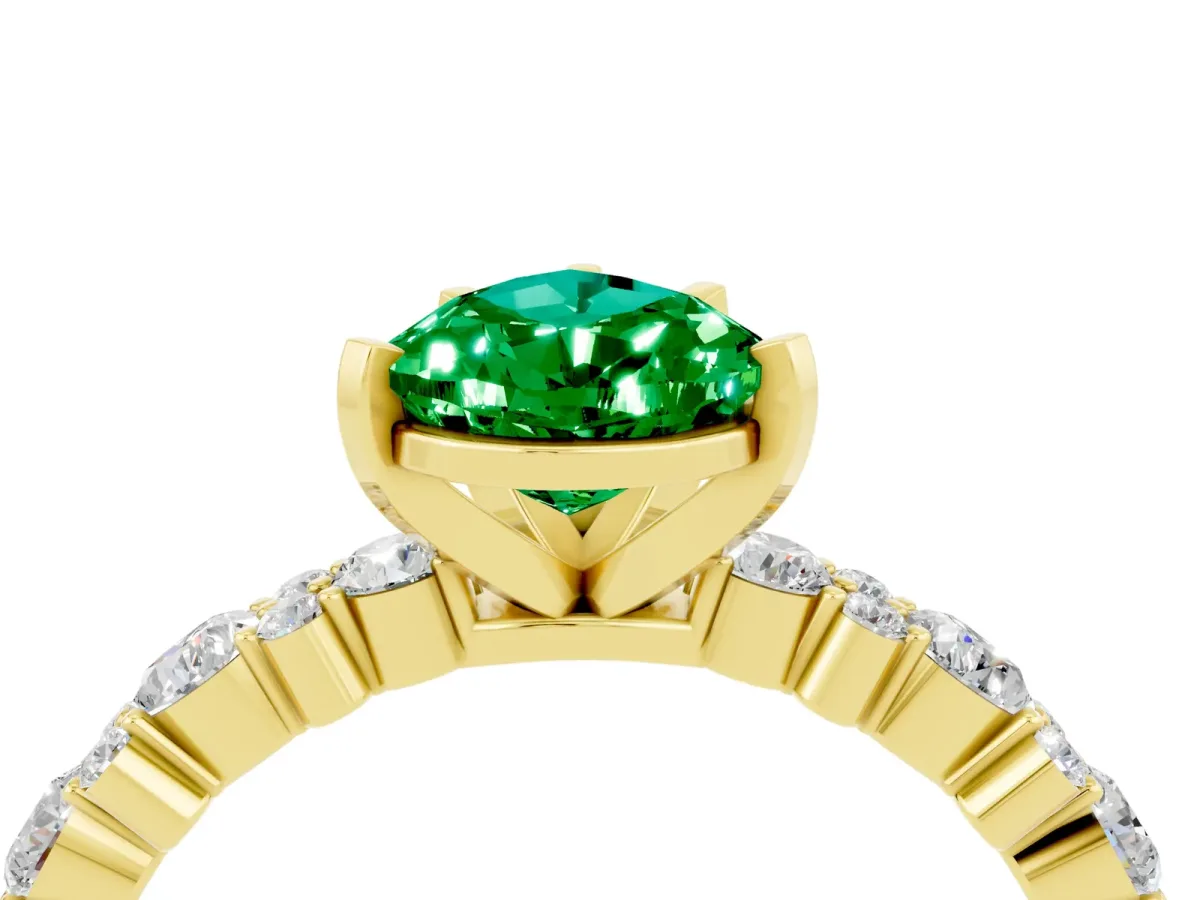 Pear Cut Emerald Side Stone Solitaire Ring with Round and Four-Prong Setting Yellow gold