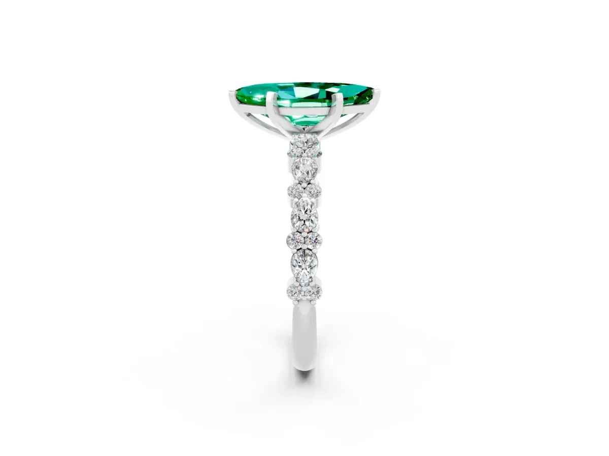 Marquise Cut Emerald Side Stone Solitaire Ring with Round and Four-Prong Setting Platinum