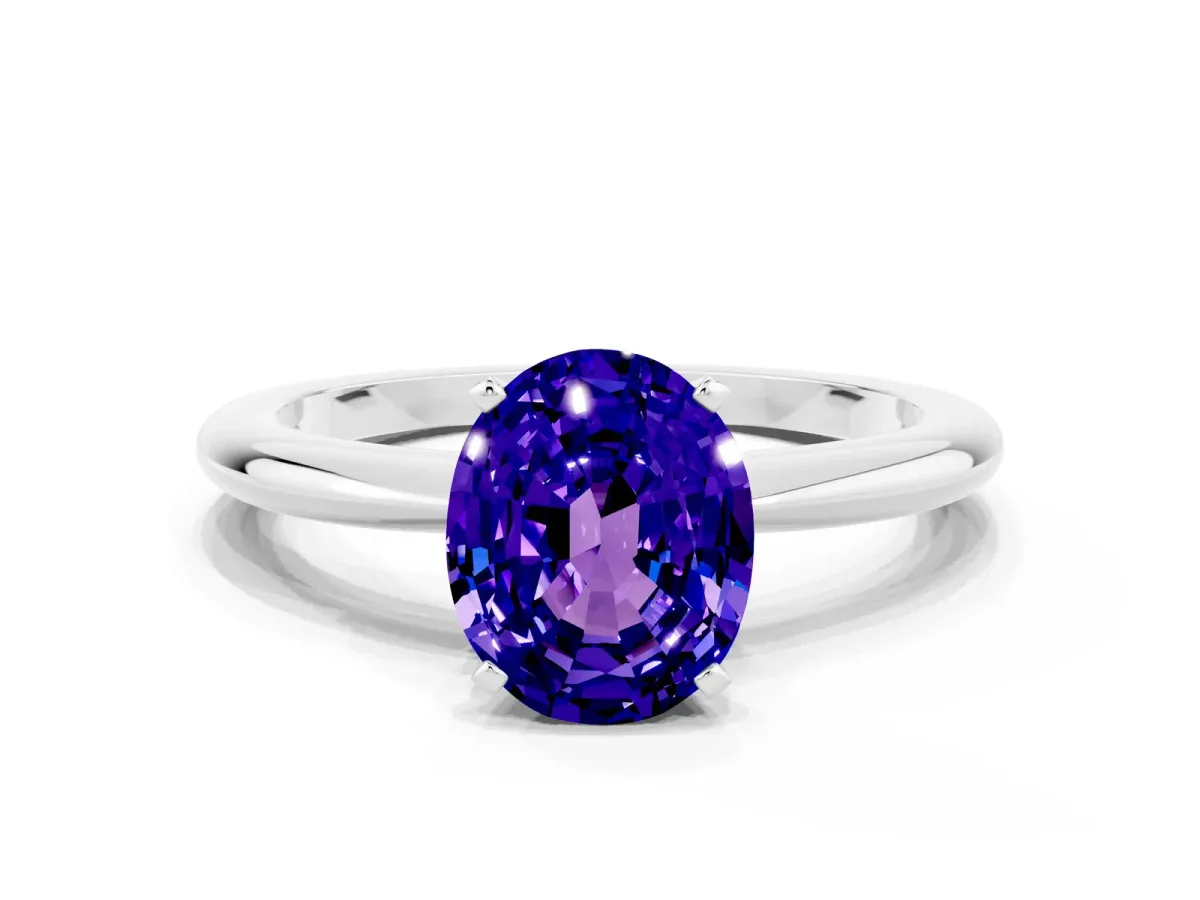 Oval Cut Tanzanite Solitaire Ring with Six-Prong Setting and Classic Band Silver