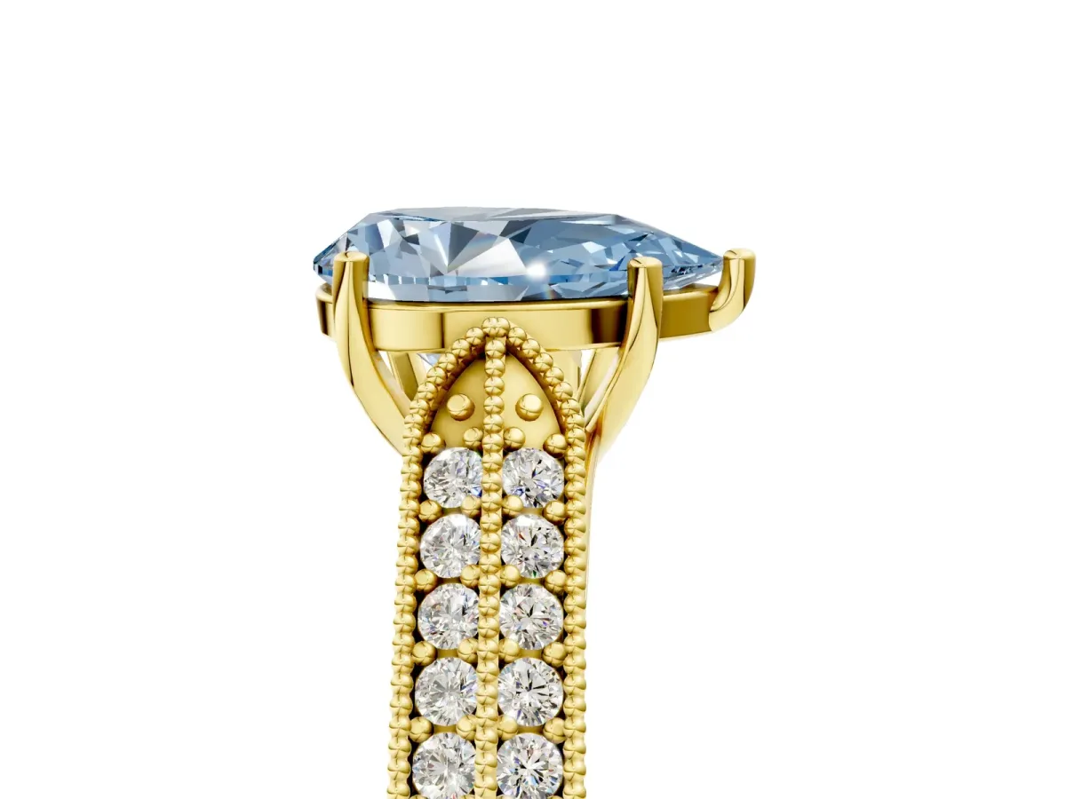 Fancy Blue Pear Cut Cut Pave Split Shank Engagement Ring with Four-Prong Setting Yellow gold