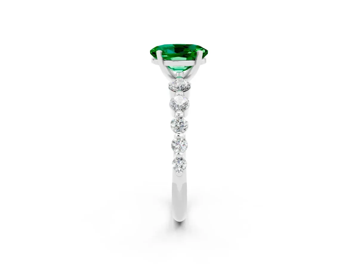Oval Cut Solitaire Emerald Ring with Pave Band and Four-Prong Setting Silver