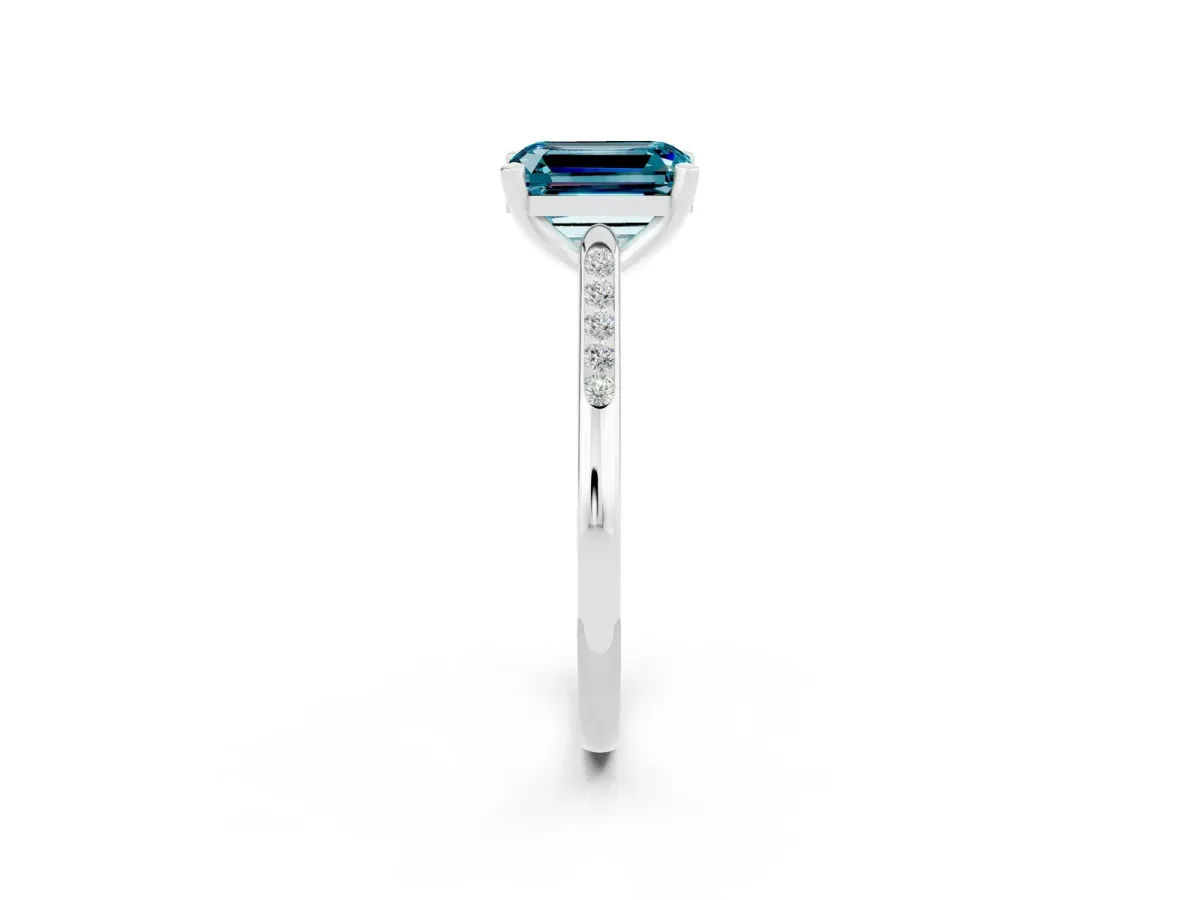 Emerald Cut Blue Topaz Solitaire Ring with Channel Set Round Band and Prong Setting Silver