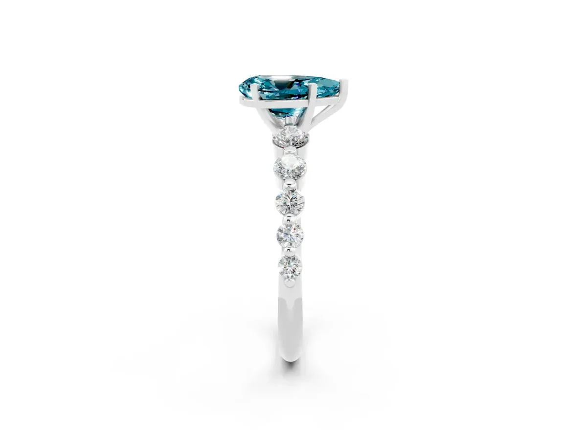 Pear Cut Solitaire Blue Topaz Ring with Pave Band and Four-Prong Setting Silver