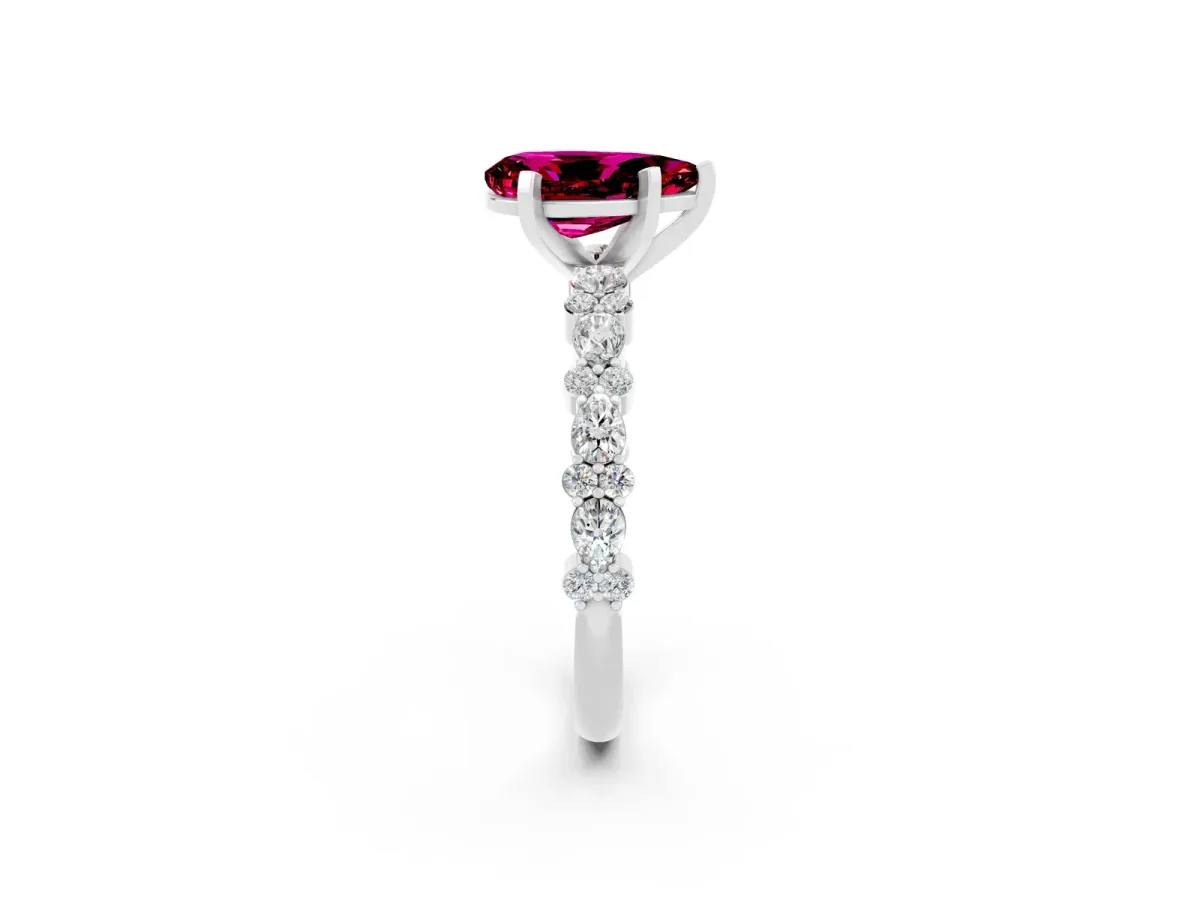 Pear Cut Garnet Side Stone Solitaire Ring with Round and Four-Prong Setting Silver