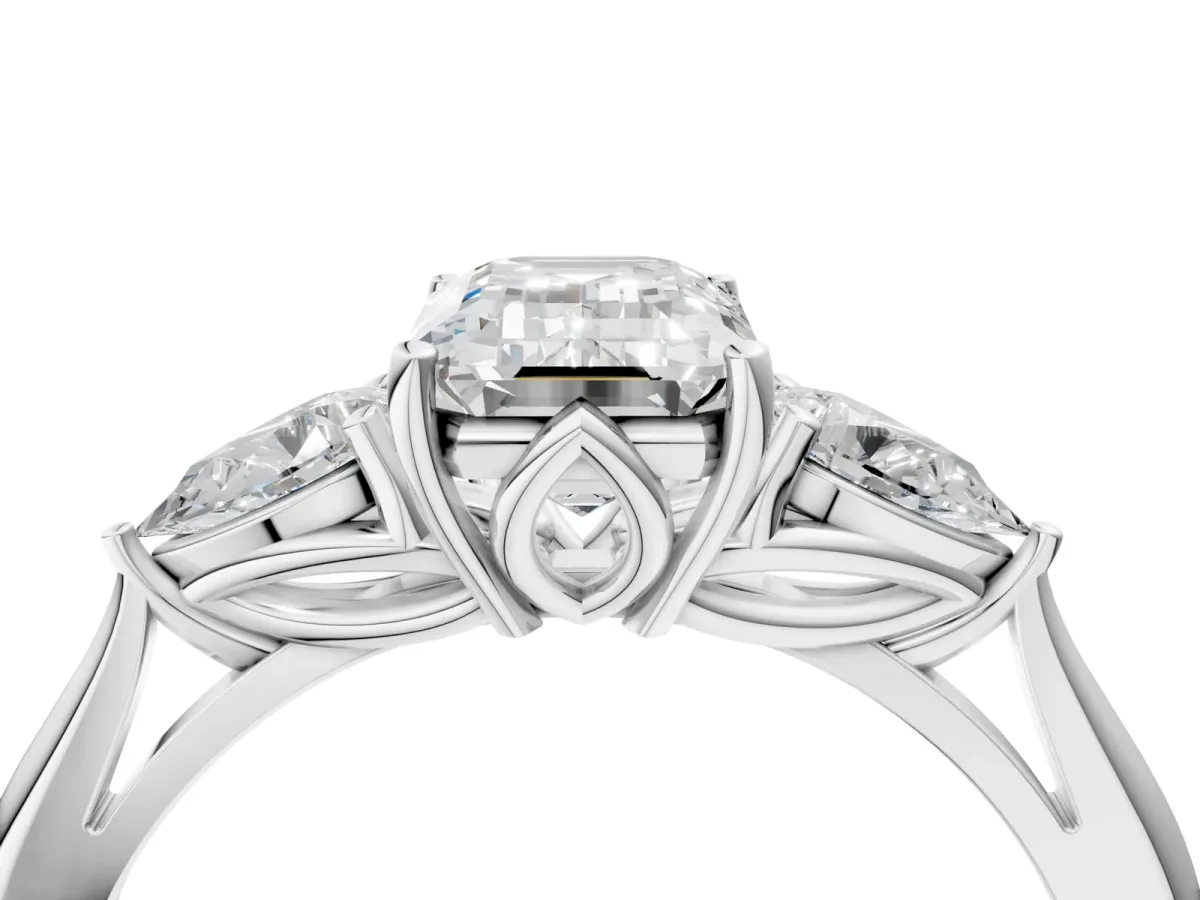 Three-Stone Emerald Cut Diamond Ring with Pear Side Stones in Four-Prong Setting White gold