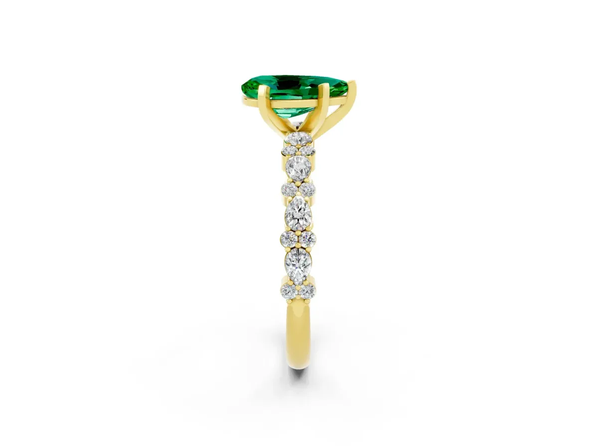 Pear Cut Emerald Side Stone Solitaire Ring with Round and Four-Prong Setting Yellow gold