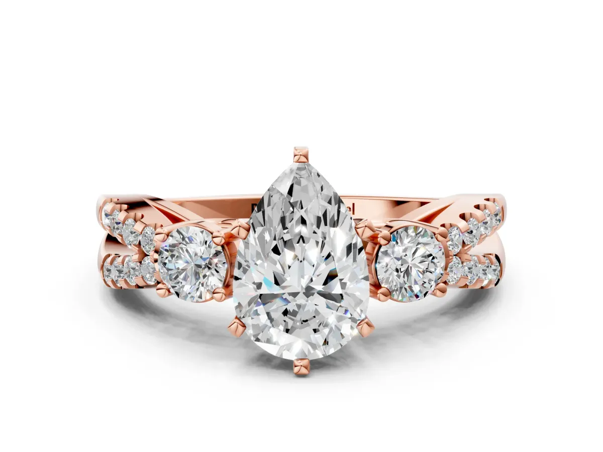 Pear Cut Diamond Three-Stone Ring with Pavé Split Shank and Four-Prong Setting Rose gold
