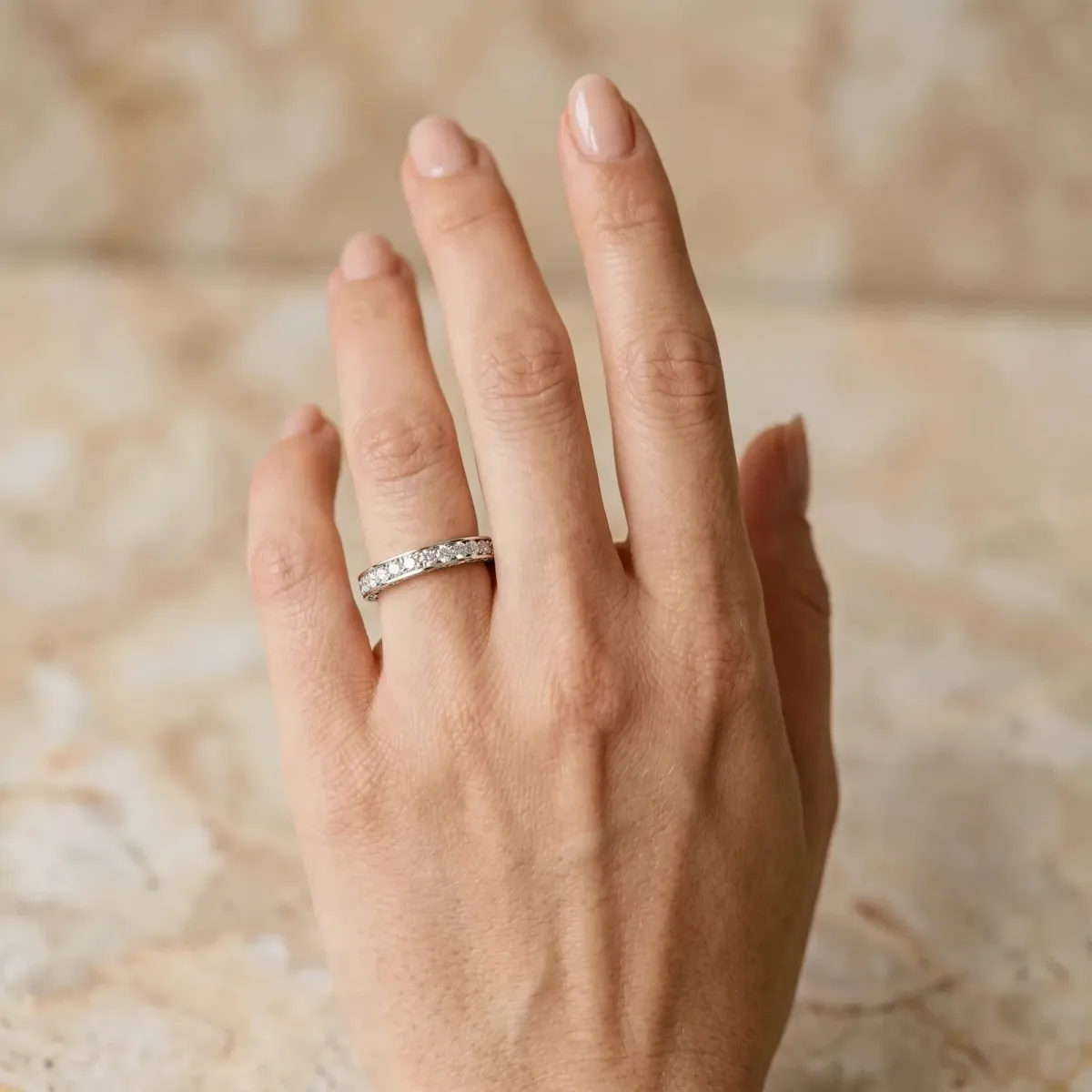 Round Cut Diamond Pavé Eternity Band with Channel Setting Platinum