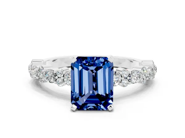 Emerald Cut Blue Sapphire Side Stone Solitaire Ring with Round and Four-Prong Setting White gold
