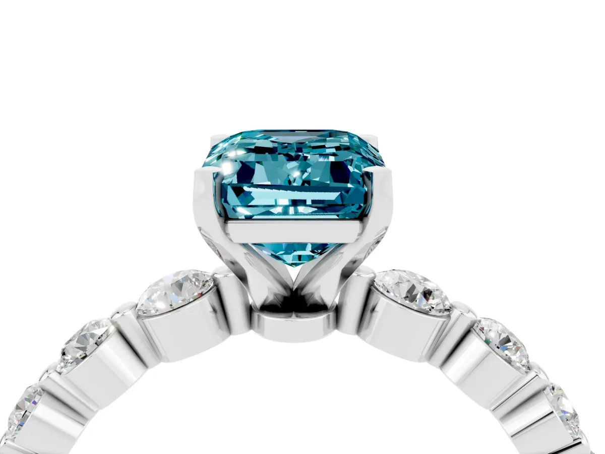 Emerald Cut Solitaire Blue Topaz Ring with Pave Band and Four-Prong Setting Platinum