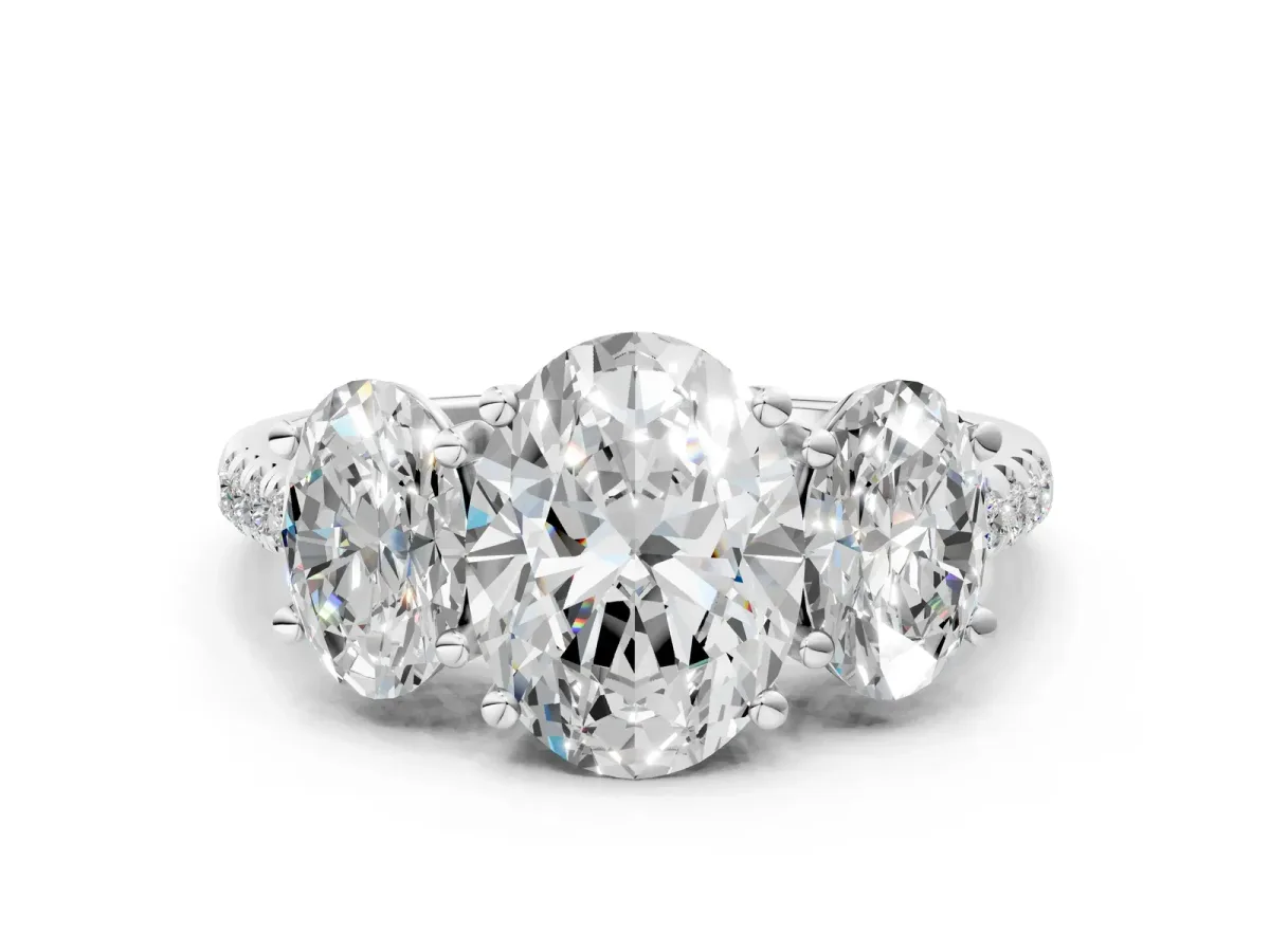 Three-Stone Oval Cut Diamond Ring with Round Pavé Band and Prong Setting Platinum