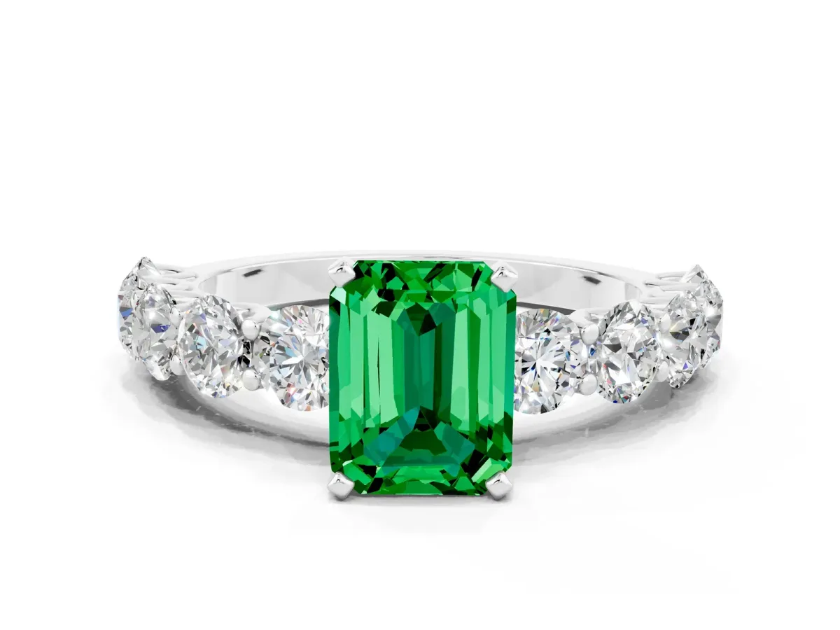 Emerald Cut Emerald Prong Setting with Side Stones on a Pave Band Platinum