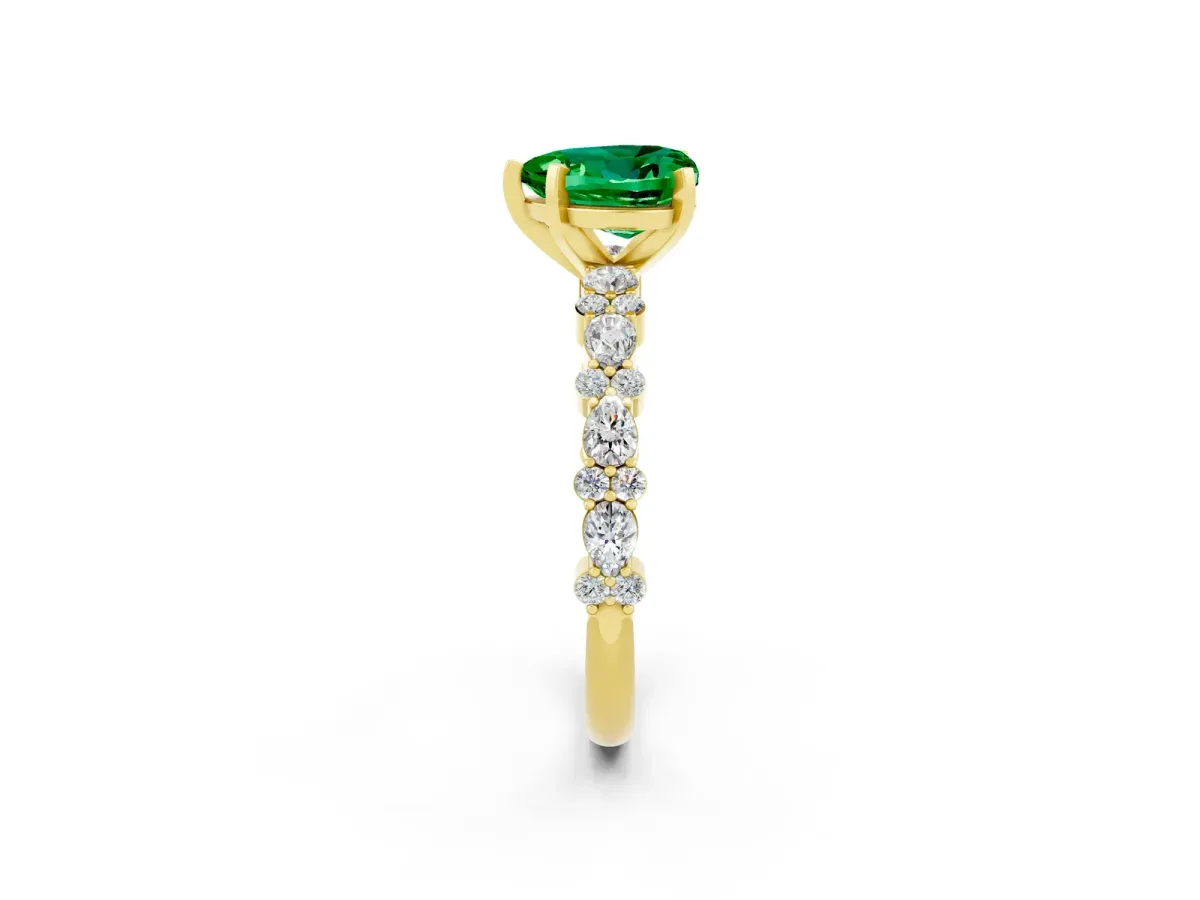 Heart Cut Emerald Side Stone Solitaire Ring with Round and Four-Prong Setting Yellow gold
