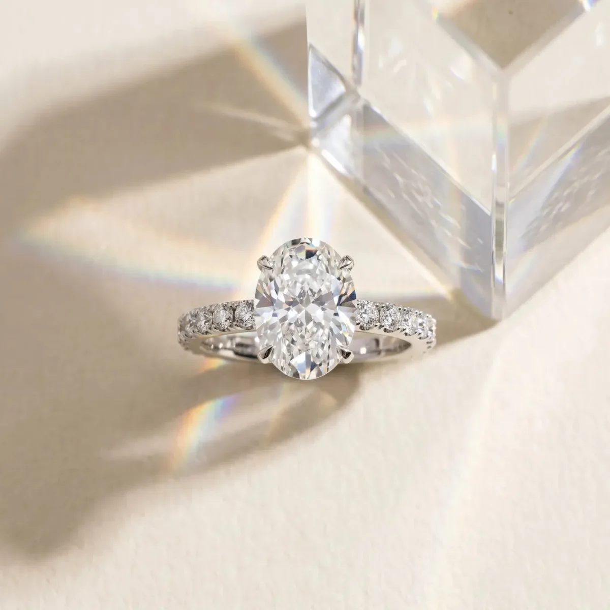 Oval Cut Diamond Solitaire Pavé Band with Four-Prong Setting White gold