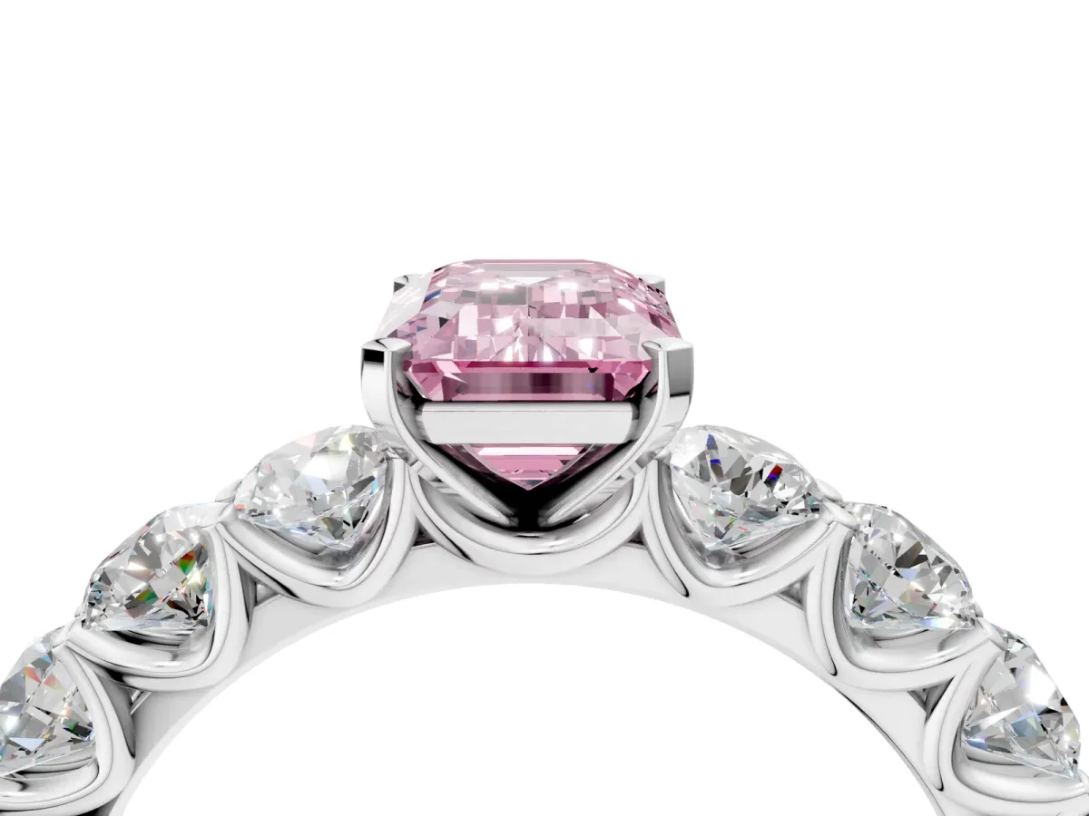 Fancy Pink Emerald Cut Diamond Prong Setting with Side Stones on a Pave Band Platinum