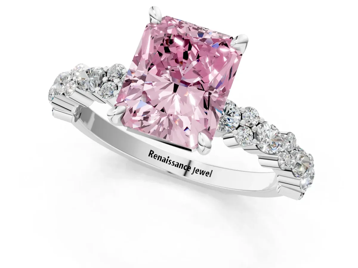 Fancy Pink Radiant Cut Diamond Side Stone Solitaire Ring with Round and Four-Prong Setting Platinum