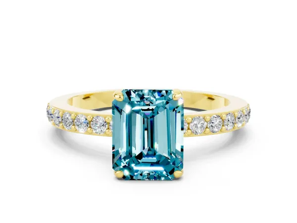 Emerald Cut Blue Topaz Solitaire Engagement Ring with Pavé Band and Four-Prong Setting Yellow gold