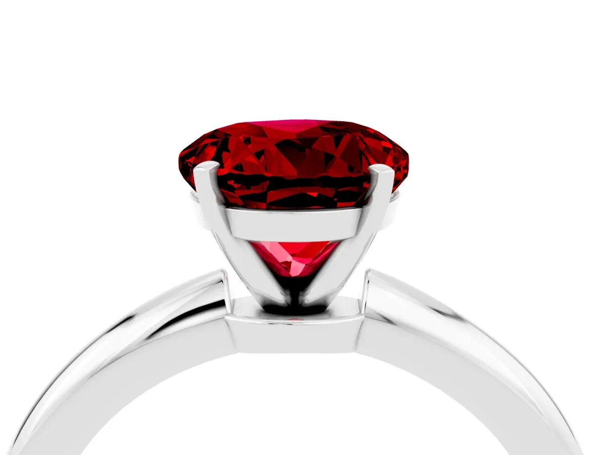 Round Cut Ruby Solitaire Ring with Six-Prong Setting and Classic Band Platinum