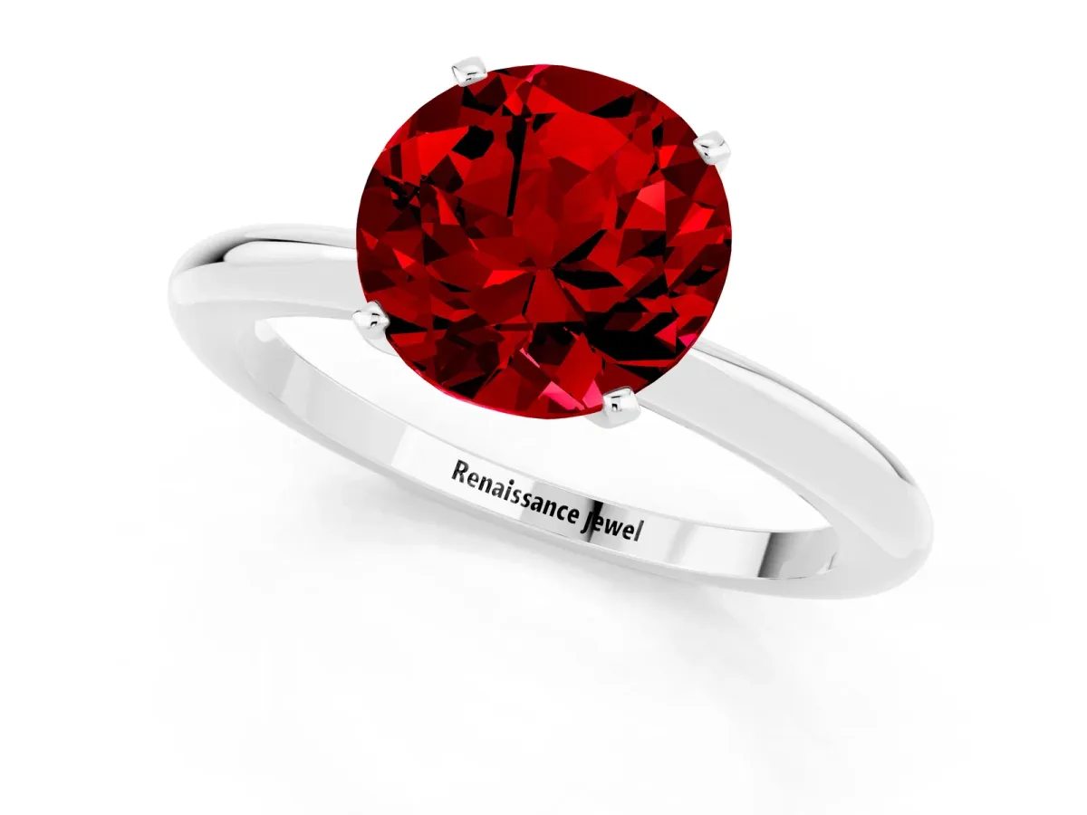 Round Cut Ruby Solitaire Ring with Six-Prong Setting and Classic Band Platinum