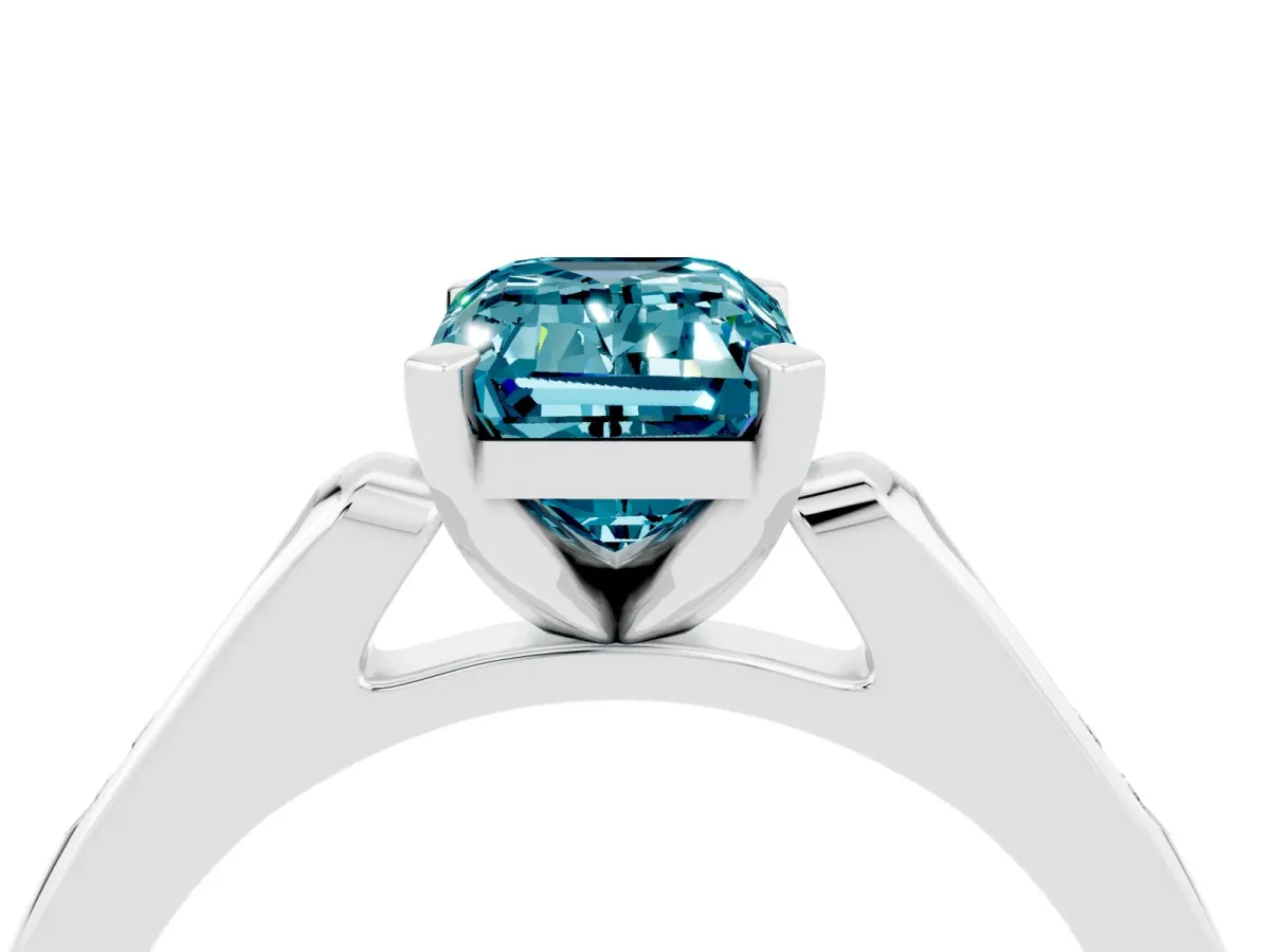 Emerald Cut Blue Topaz Solitaire Ring with Channel Set Round Band and Prong Setting Silver